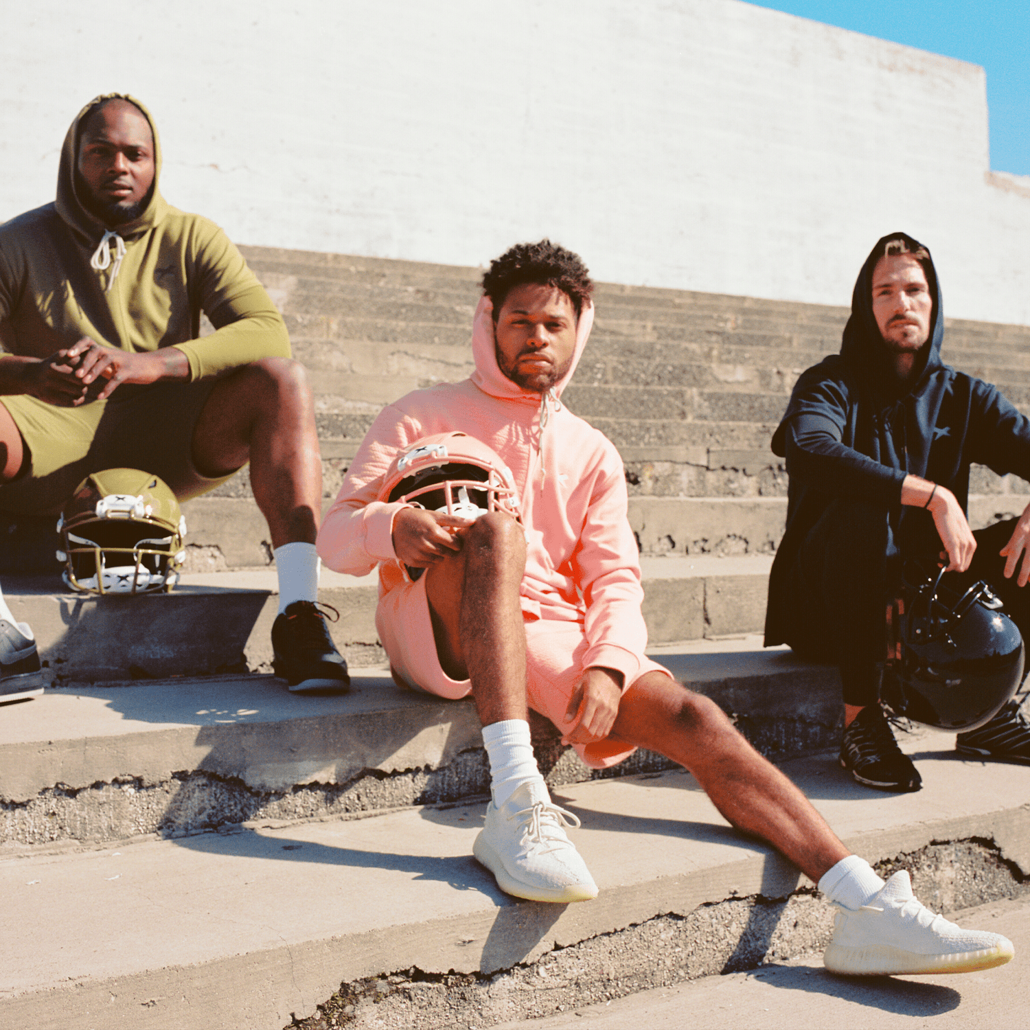 Three male models wearing the Peak ISO collection.