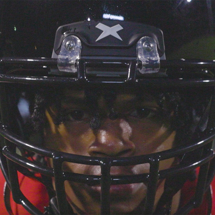 Close up of Christian Henderson wearing a football helmet.