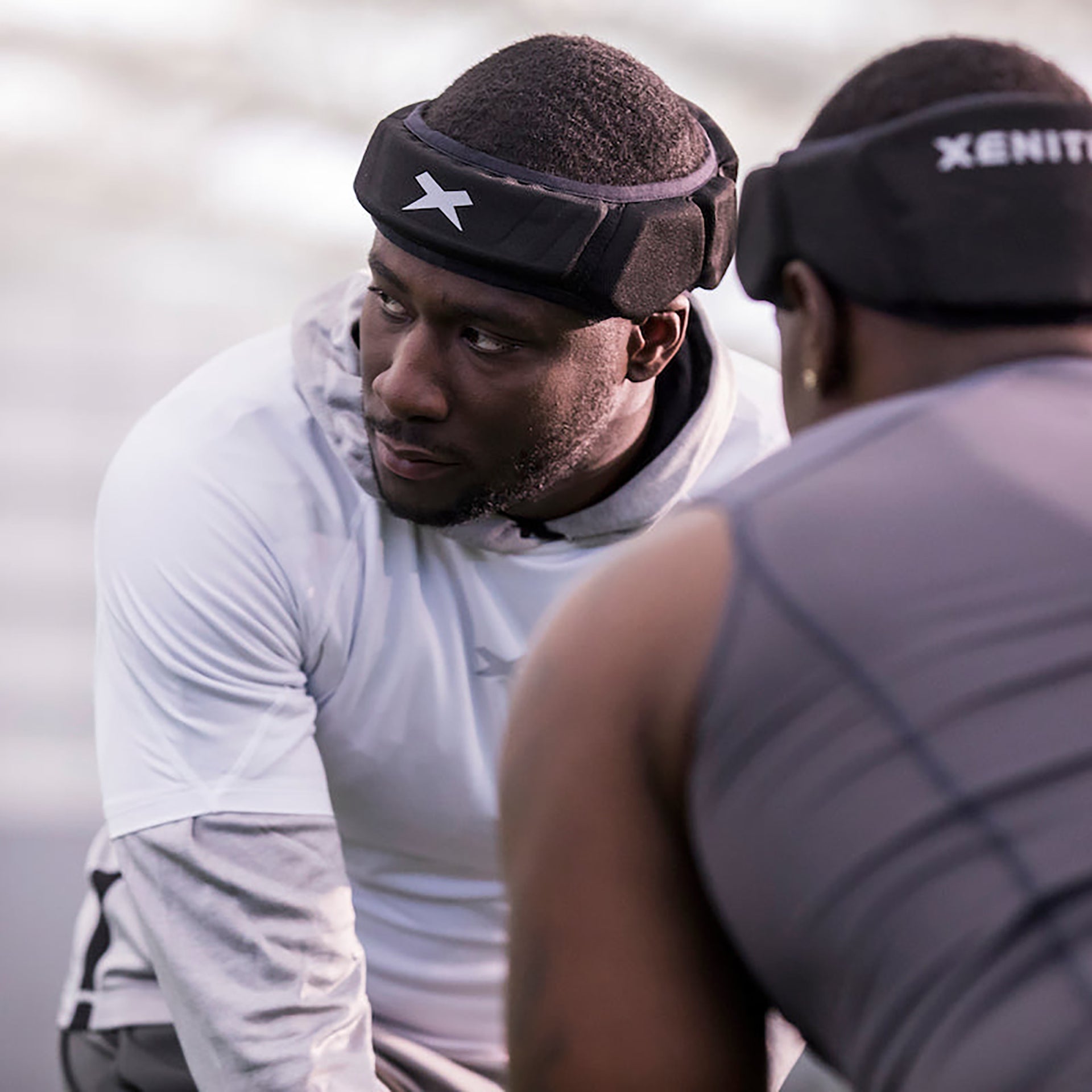 Football players wearing Xenith LOOP line-up before a play.