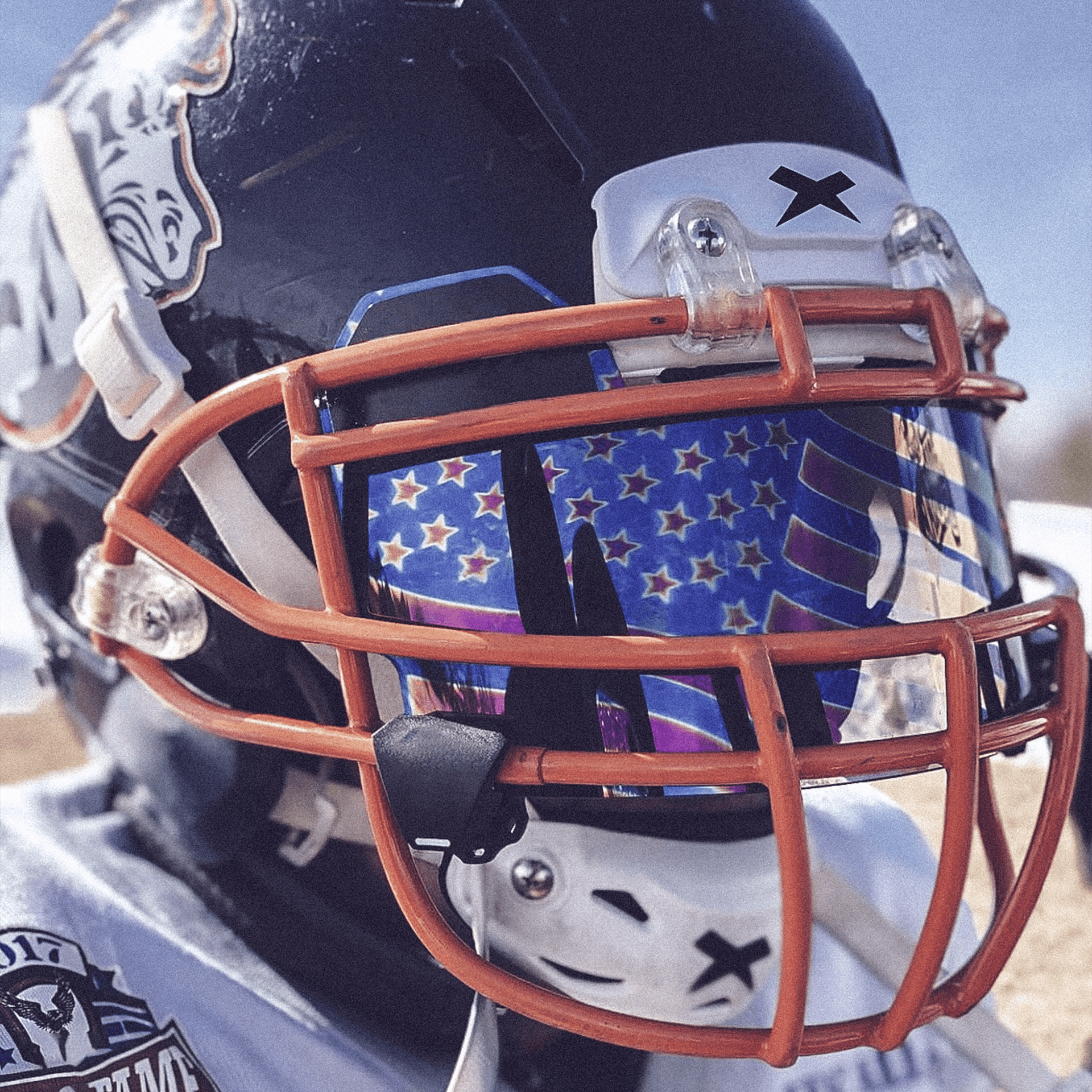Close-up of a football player wearing a helmet.