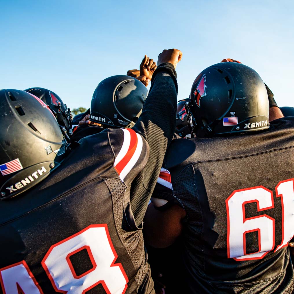 Shaw High School football team during a huddle.