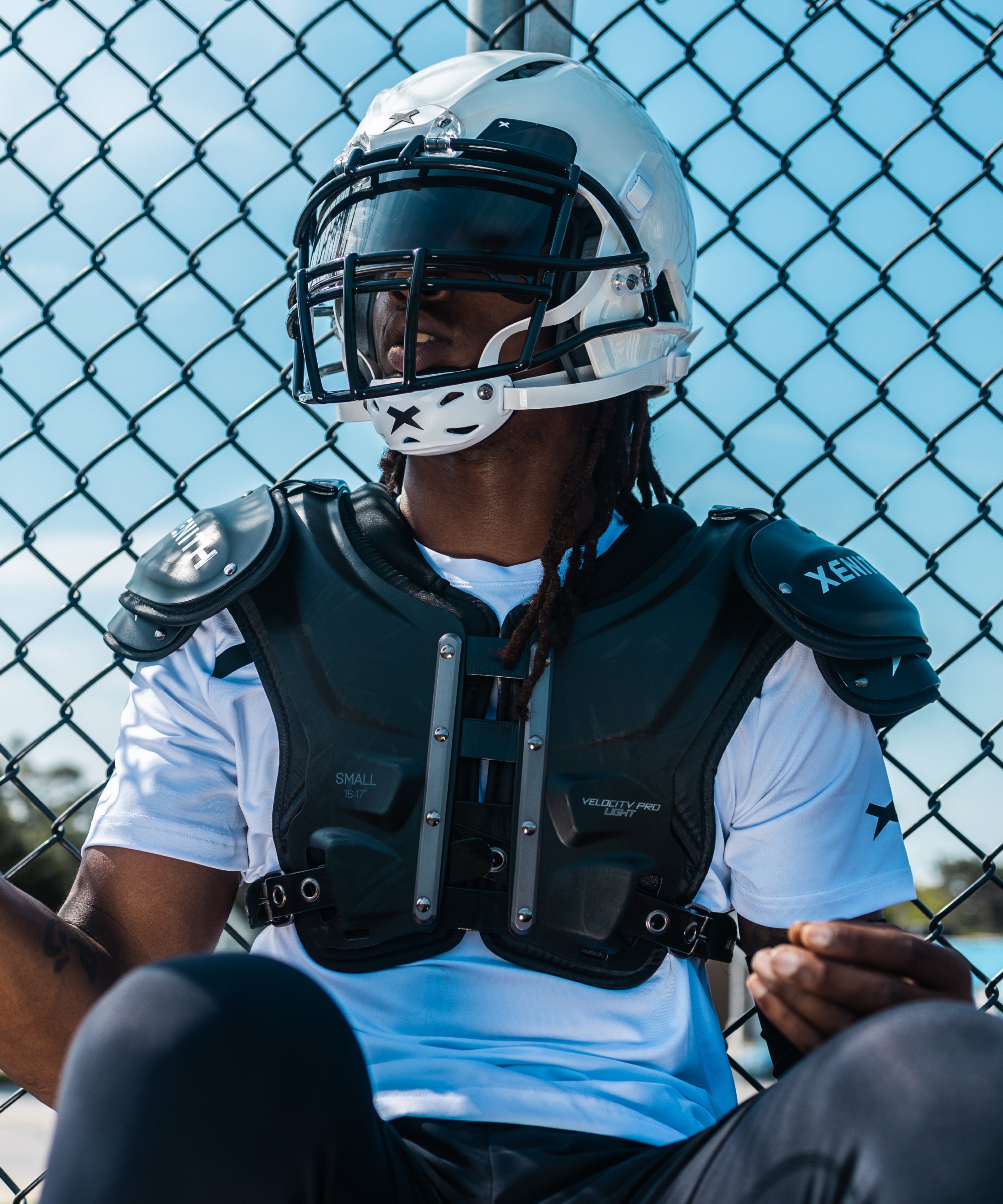 varsity football player wearing velocity 2 pro shoulder pads