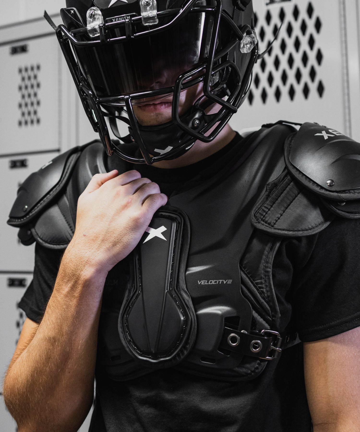 varsity player wearing velocity 2 shoulder pads