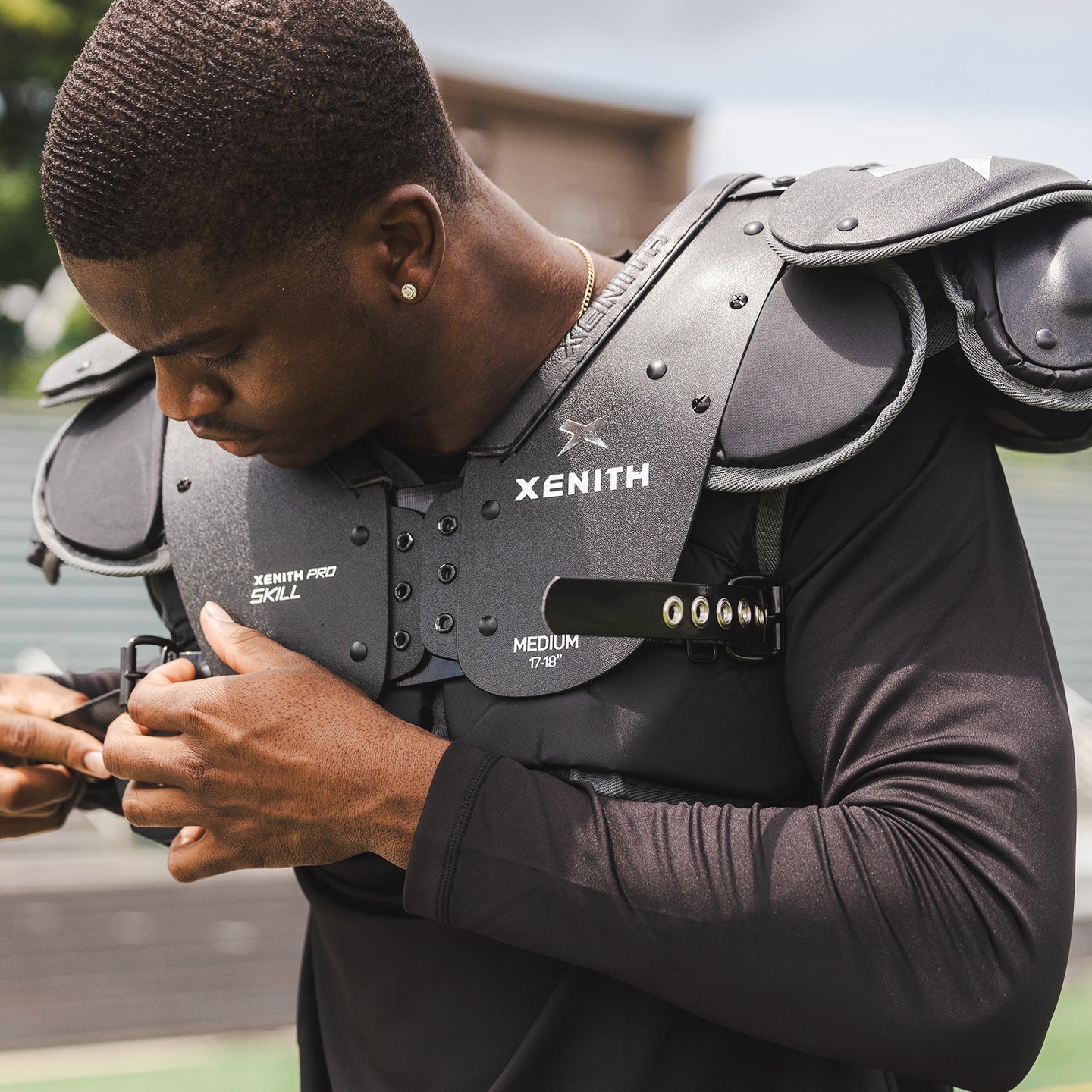 Player wearing xenith pro shoulder pads