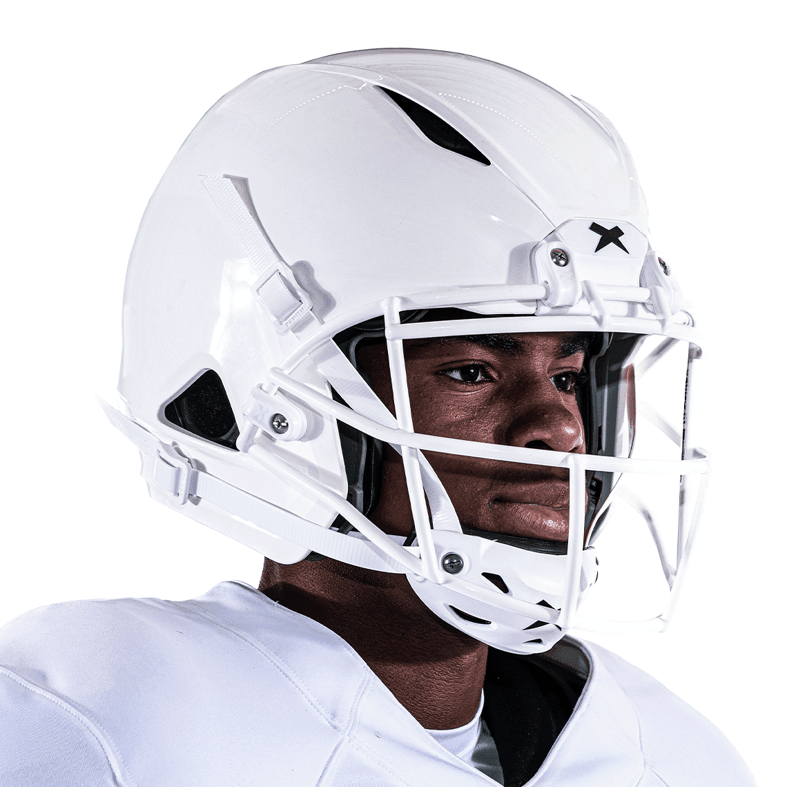 Front angled view of white XRS-21X Facemask attached to white helmet worn on athlete.