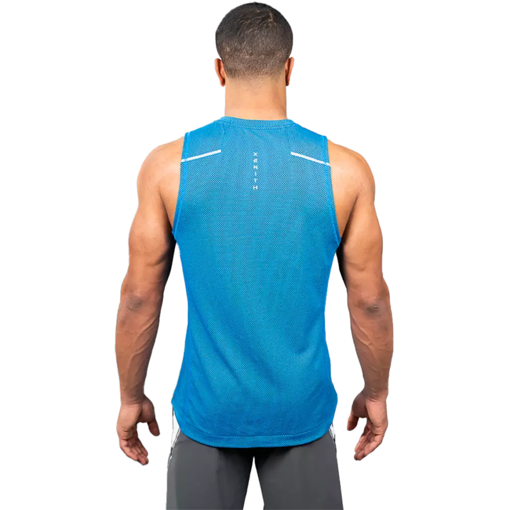 Male model in cobalt blue sleeveless shirt with reflective Xenith-X logo, from front.