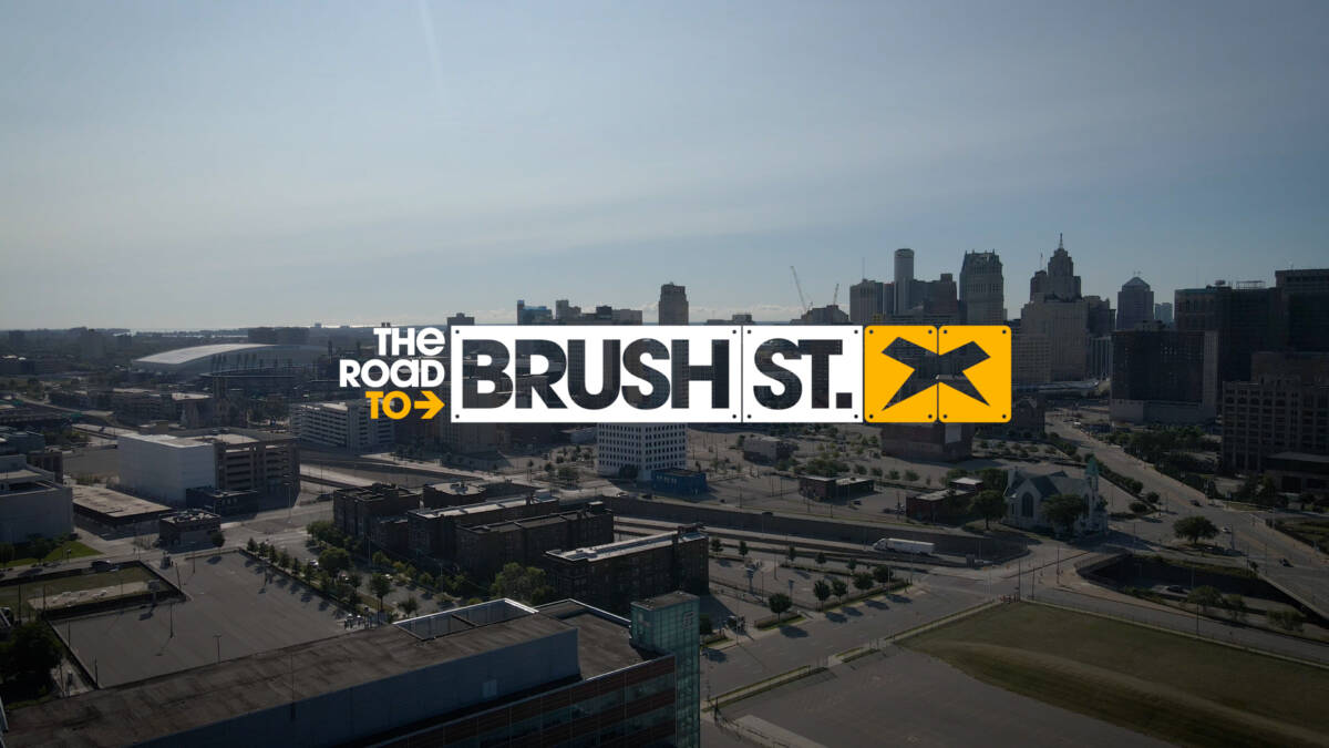 Drone shot of downtown Detroit with the words "The Road to Brush St." next to the Xenith logo.