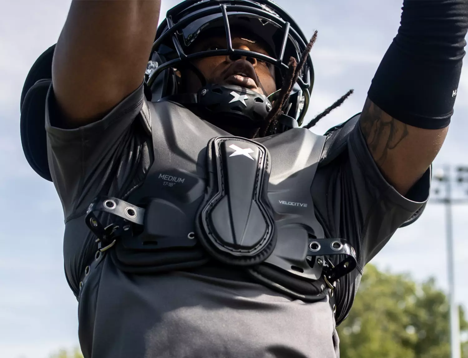 Close up of a player wearing Xenith Velocity 2 shoulder pads.