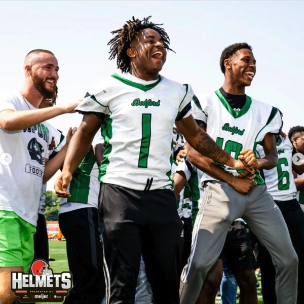 Bedford High School players jumping and celebrating.