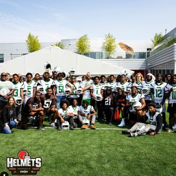 The Bedford High School football team posing together with their new Xenith helmets.