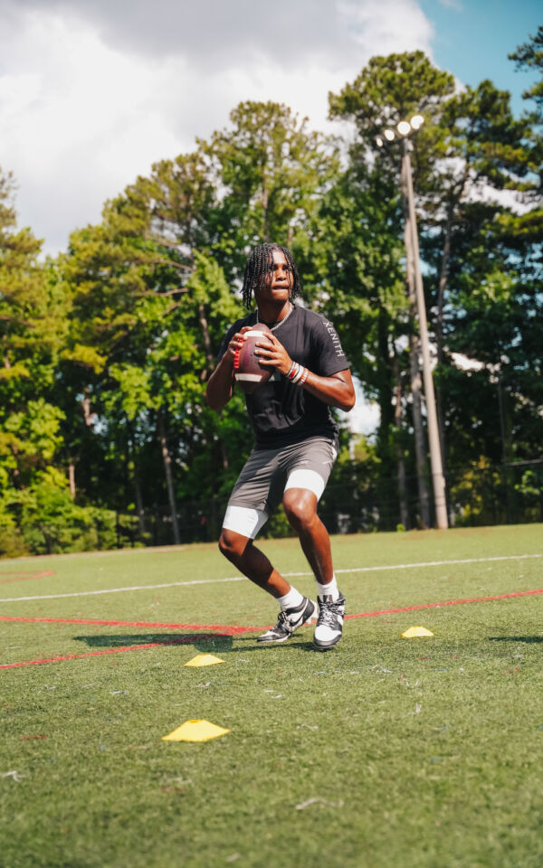 Prince running quarterback drills.