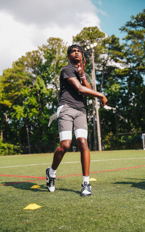 Prince running quarterback drills.