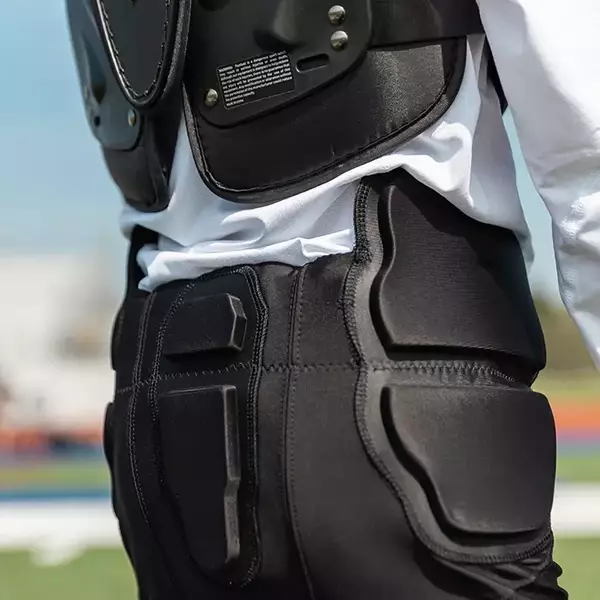 Backside view of player wearing Xenith Integrated Pants black.